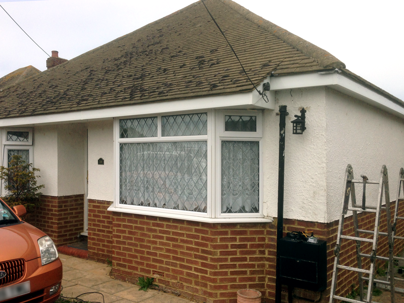 Bungalow with new white render, uPVC windows and fascia boards